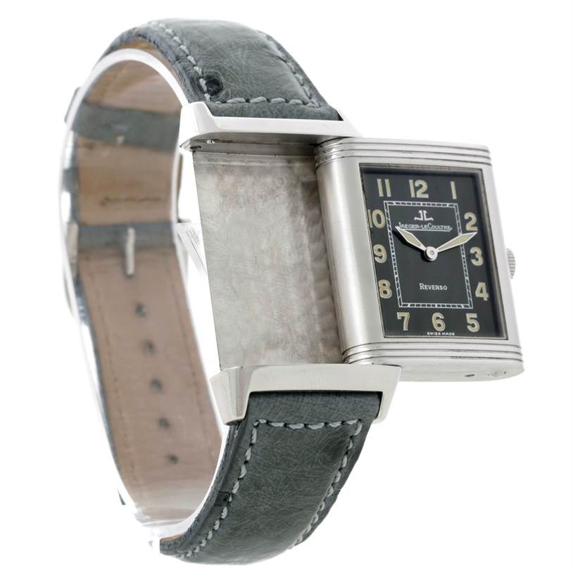 The image shows a Jaeger LeCoultre Reverso 271.8.61 Men's Stainless Steel Grey Dial 271.8.61 Men's Stainless Steel Grey Dial watch from an angled side view with the case rotated, revealing the back and strap.