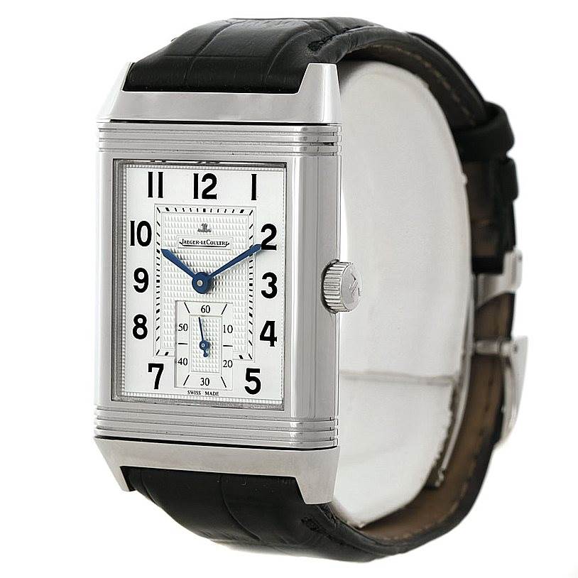 This image shows a Jaeger-LeCoultre Reverso watch from a slight side angle, highlighting the face, crown, and leather strap.