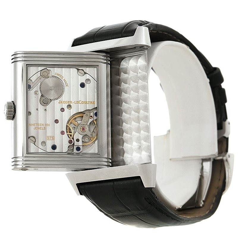 The image shows the Jaeger LeCoultre Reverso 273.8.04 Men's Stainless Steel Silver Dial 273.8.04 Men's Stainless Steel Silver Dial model from a side angle, highlighting the open case back and internal mechanics.