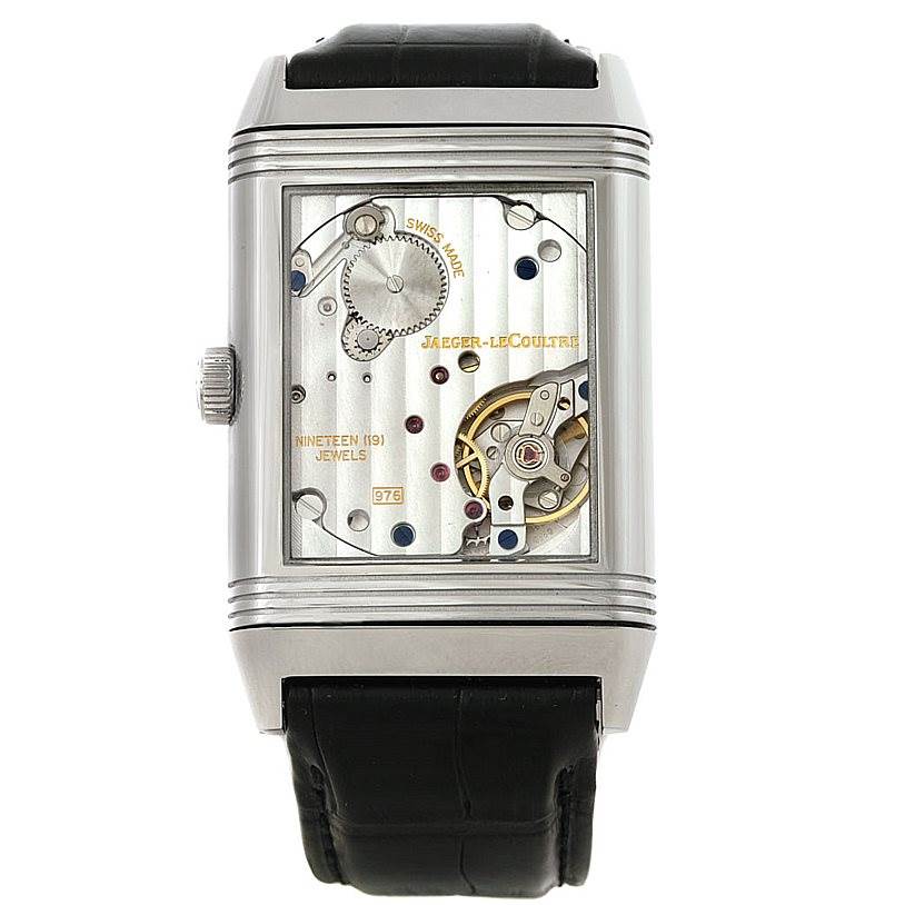The image shows a frontal view of the Jaeger LeCoultre Reverso 273.8.04 Men's Stainless Steel Silver Dial 273.8.04 Men's Stainless Steel Silver Dial watch, displaying its inner mechanics and components.