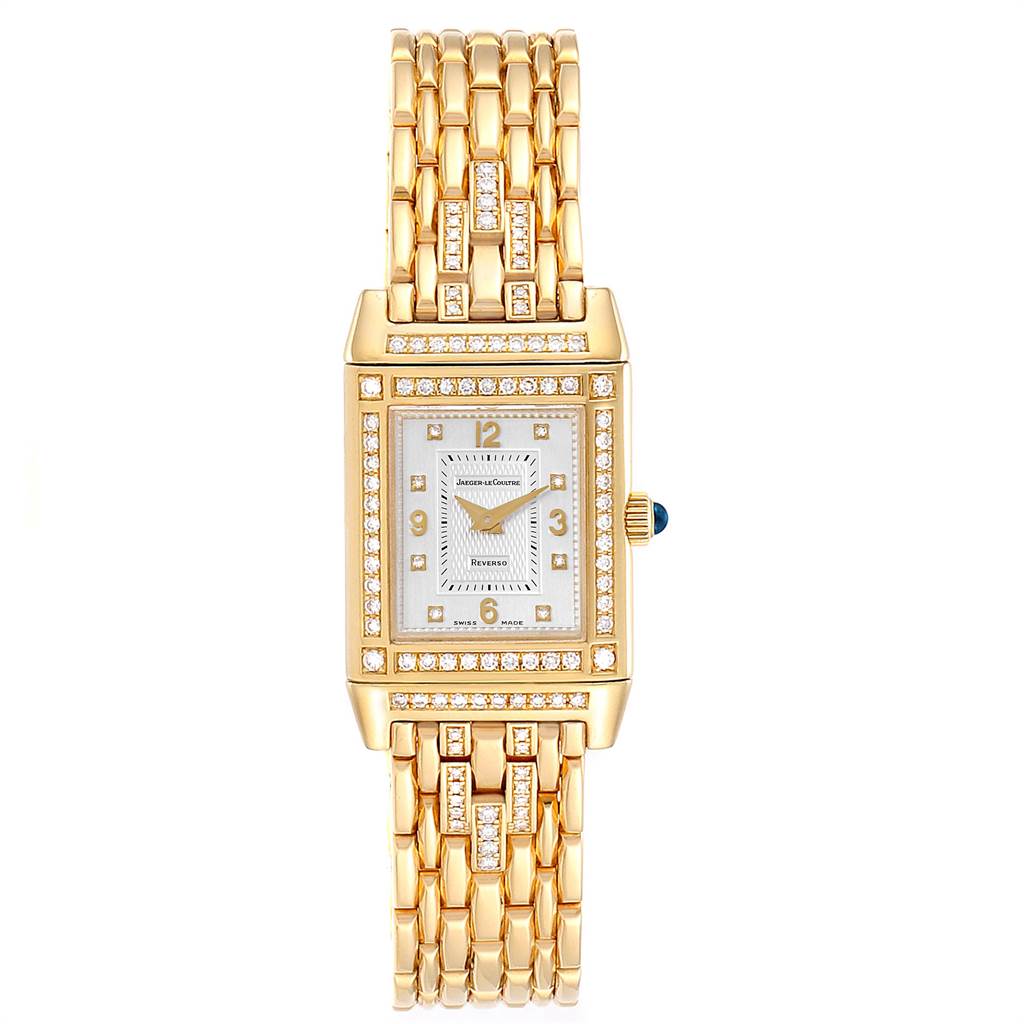 The image shows a frontal view of a Jaeger LeCoultre Reverso 267.1.86 Women's Yellow Gold Silver Dial 267.1.86 Women's Yellow Gold Silver Dial watch showcasing its gold bracelet and rectangular, diamond-set case.