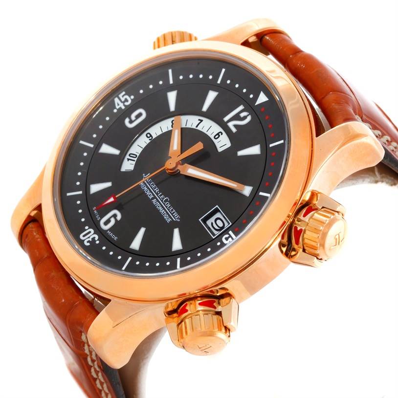 The Jaeger LeCoultre Master Q1702440 Men's Rose Gold Black Dial Q1702440 Men's Rose Gold Black Dial model watch is shown at an oblique angle, highlighting the dial, two crowns, and part of the leather strap.