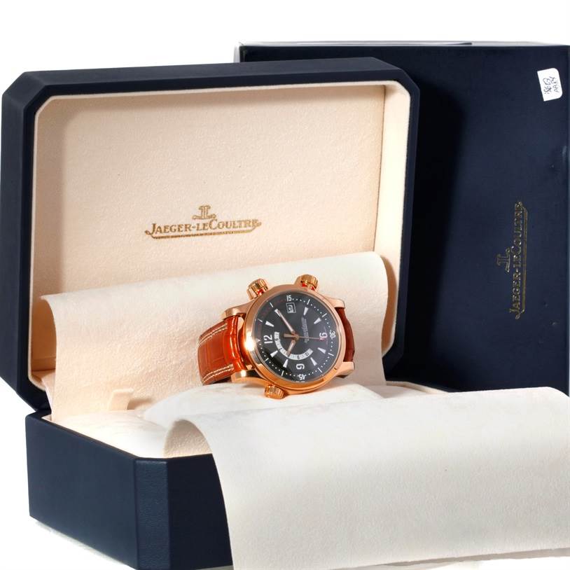 The image shows a Jaeger-LeCoultre Master model watch in its open box, viewed from an angle showcasing the watch face and strap.