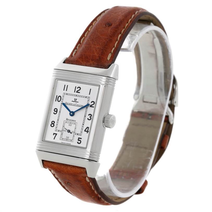 The image shows a Jaeger-LeCoultre Reverso watch angled to display the watch face, crown, and the brown leather strap.