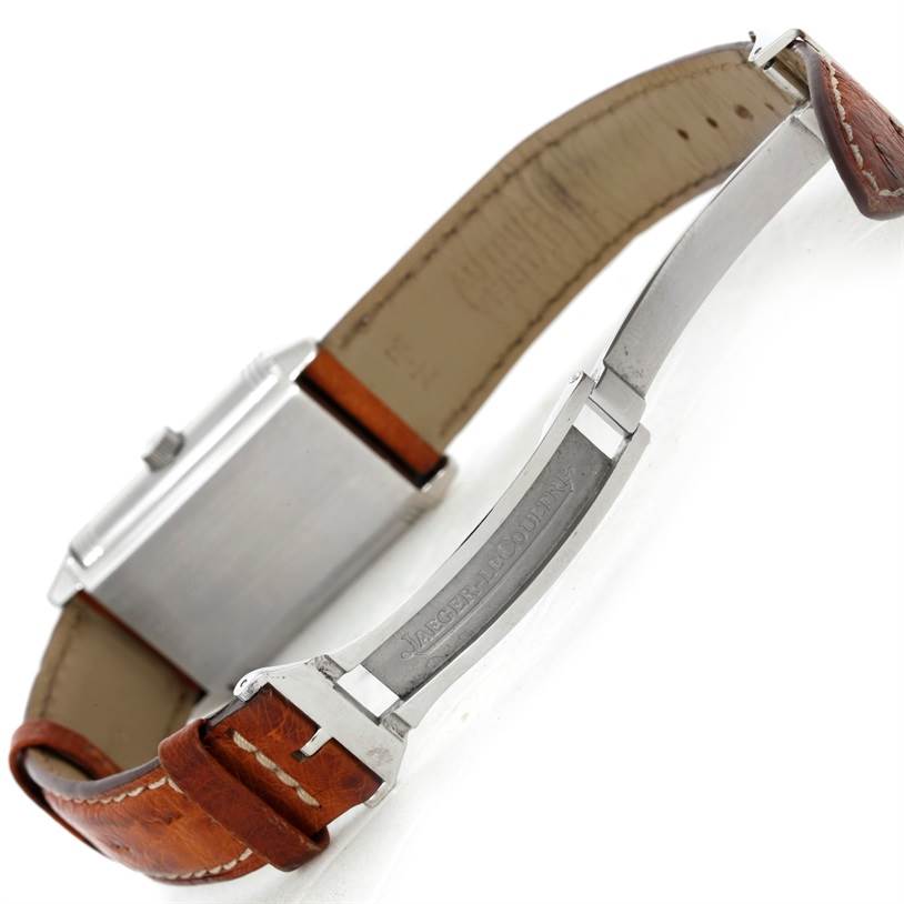 The image shows a Reverso model by Jaeger-LeCoultre from the side, focusing on its case, leather strap, and clasp.