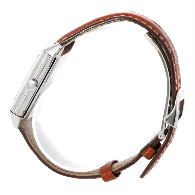 This side view of the Jaeger LeCoultre Reverso 2708410 Men
s Stainless Steel Silver Dial 2708410 Men
s Stainless Steel Silver Dial watch shows its crown, case edges, and brown leather strap with a buckle.