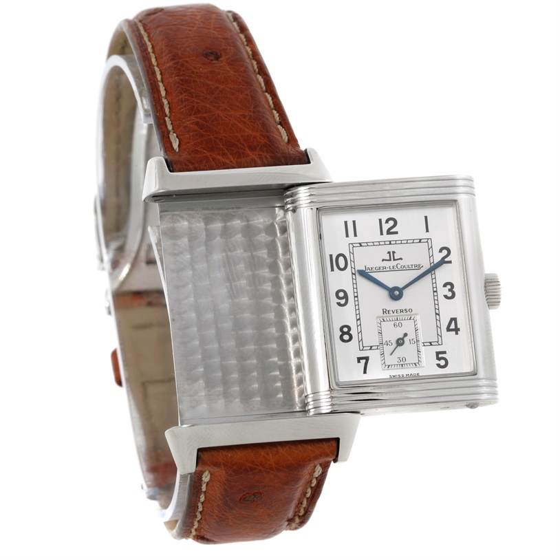 The image shows a Jaeger LeCoultre Reverso 2708410 Men
s Stainless Steel Silver Dial 2708410 Men
s Stainless Steel Silver Dial watch with its face partially swiveled to display the metal back and leather strap.