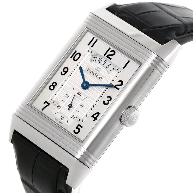 The image shows a Jaeger LeCoultre Reverso 3748421 Men's Stainless Steel Silver Dial 3748421 Men's Stainless Steel Silver Dial model watch from an angled side view, highlighting its dial, case, crown, and leather strap.