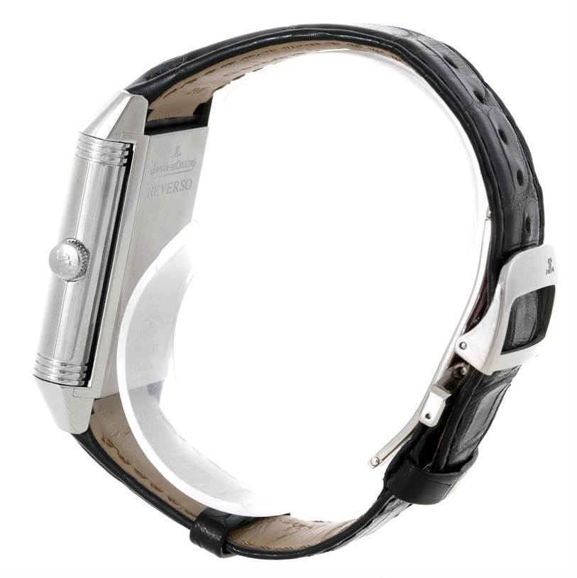 The image shows the side view of a Jaeger LeCoultre Reverso 3748421 Men's Stainless Steel Silver Dial 3748421 Men's Stainless Steel Silver Dial watch, highlighting its crown, case, and leather strap with buckle.