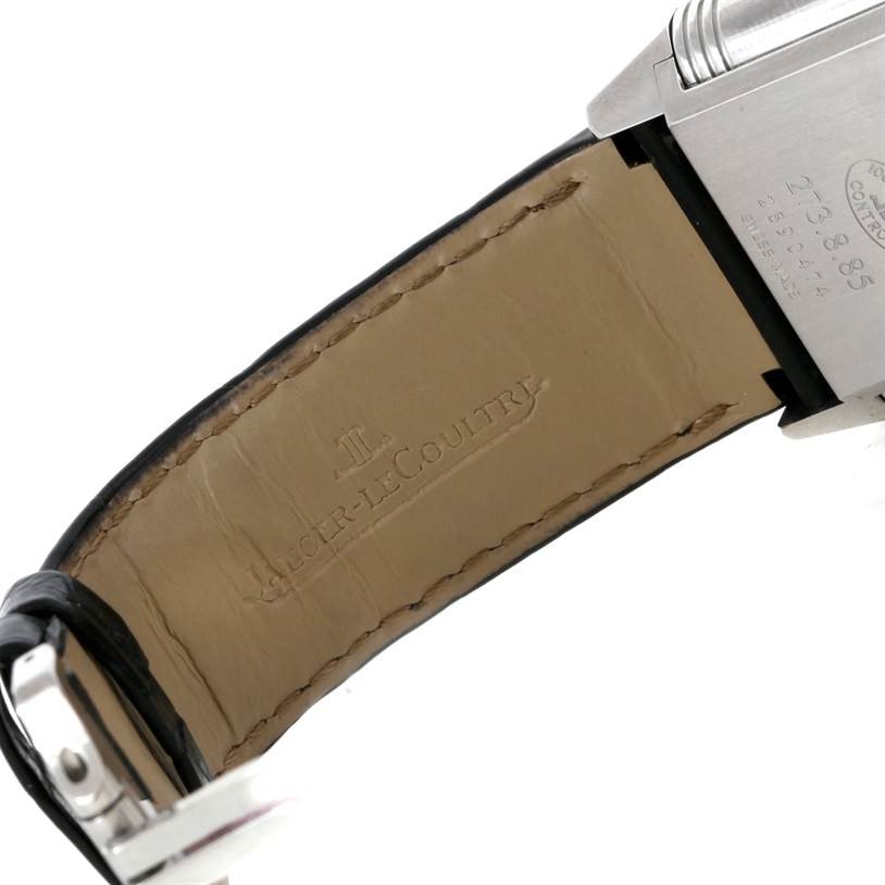 The image shows the underside of the strap and part of the caseback of a Jaeger-LeCoultre Reverso watch.