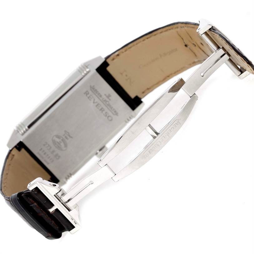 The image shows the backside and clasp of a Jaeger LeCoultre Reverso 273.8.85 Men
s Stainless Steel Silver Dial 273.8.85 Men
s Stainless Steel Silver Dial watch, including its deployment buckle and leather strap.