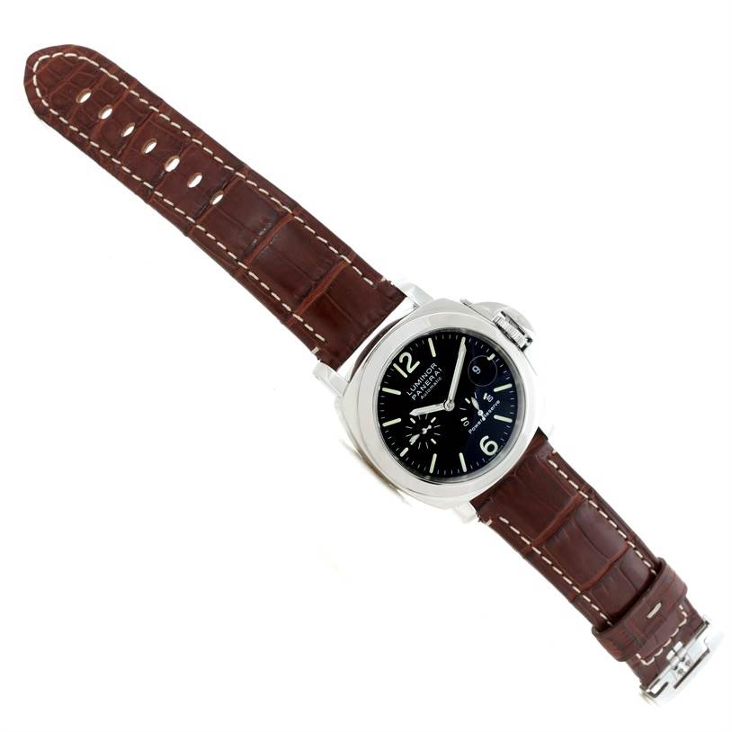 This image displays a Panerai Luminor PAM00090 Men
s Stainless Steel Black Dial PAM00090 Men
s Stainless Steel Black Dial watch from a top-down angle, showcasing its brown leather strap and watch face.