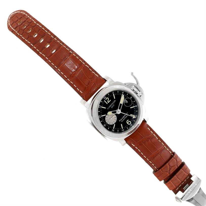 The Luminor model by Panerai is shown at an angle displaying its dial, crown guard, and brown leather strap.