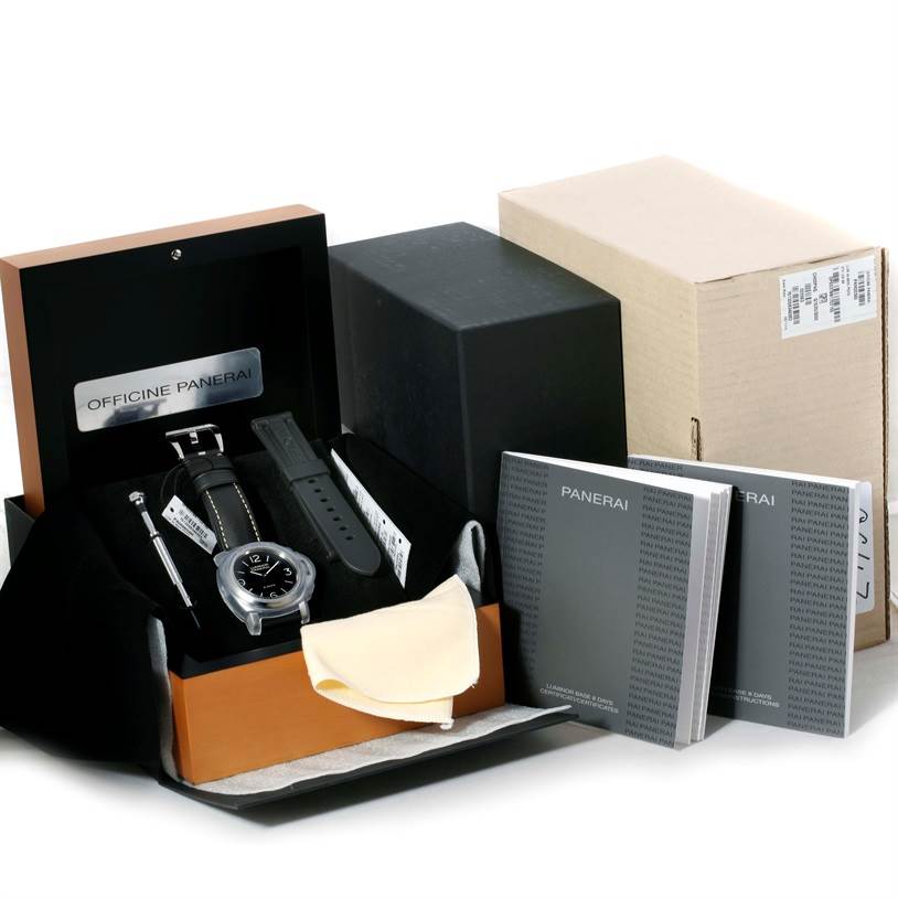 The image shows a Panerai Luminor PAM00560 Men's Stainless Steel Black Dial PAM00560 Men's Stainless Steel Black Dial watch in its open box, with an additional strap, a cloth, user manuals, and outer packaging.