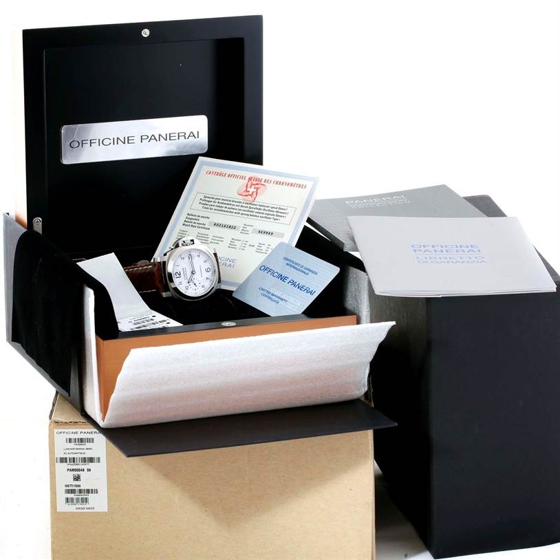 The image shows an unboxing of a Panerai Luminor PAM00049 Men's Stainless Steel White Dial PAM00049 Men's Stainless Steel White Dial watch with its accessories and documentation displayed.