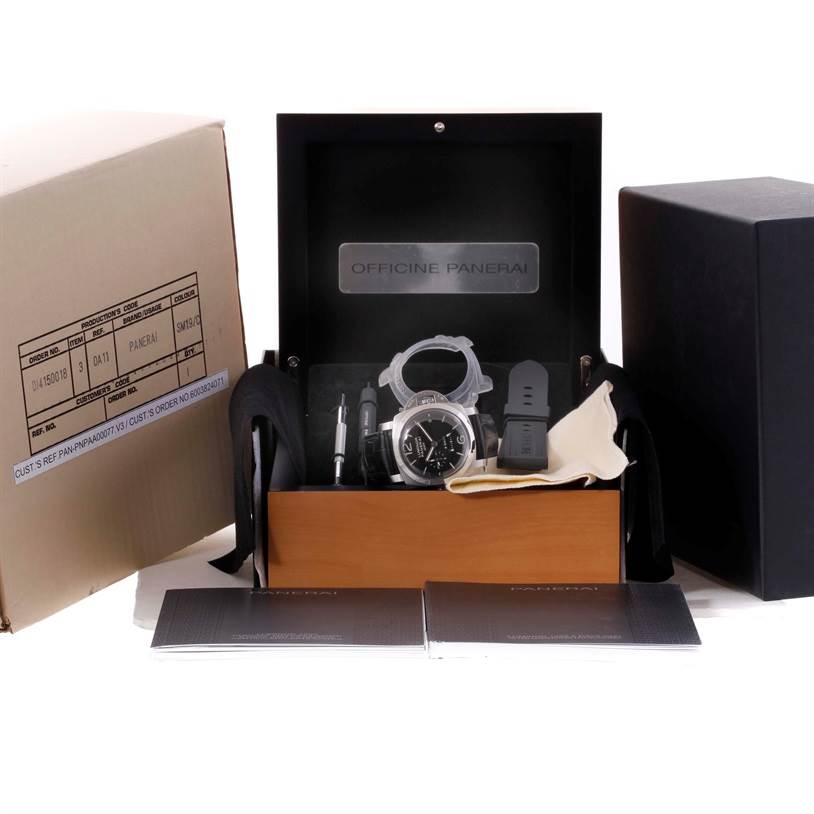 The image shows a Panerai Luminor PAM00233 Men's Stainless Steel Black Dial PAM00233 Men's Stainless Steel Black Dial watch set including the watch, extra strap, tools, cloth, and instruction booklets, from a front angle.