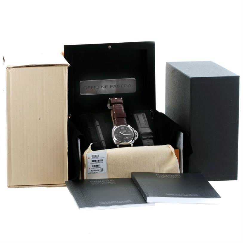 The image shows a Panerai Luminor PAM00321 Men's Stainless Steel Black Dial PAM00321 Men's Stainless Steel Black Dial watch with its box, additional straps, and accompanying manuals.