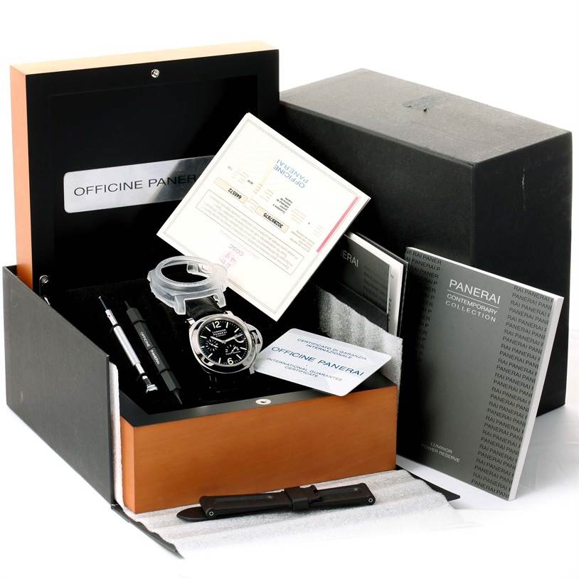 The image shows a Panerai Luminor PAM00090 Men's Stainless Steel Black Dial PAM00090 Men's Stainless Steel Black Dial watch with its box, manual, certificate, tools, and additional strap from an angled top view.