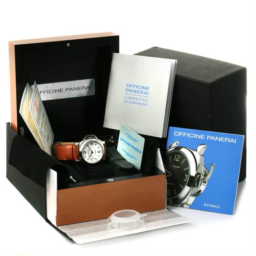 The image shows a Panerai Luminor PAM00113 Men's Stainless Steel White Dial PAM00113 Men's Stainless Steel White Dial watch and accessories from a front angle, including a box, manuals, and a warranty card.