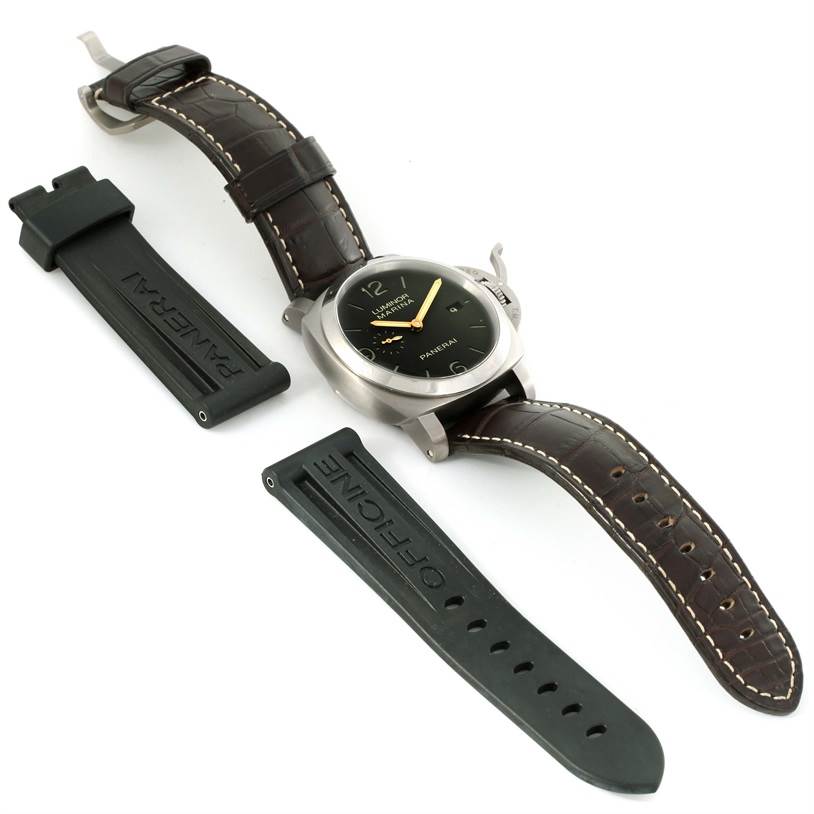 The Panerai Luminor PAM00351 Men
s Titanium Brown Dial PAM00351 Men
s Titanium Brown Dial watch is shown from an overhead angle, accompanied by two separate rubber straps.