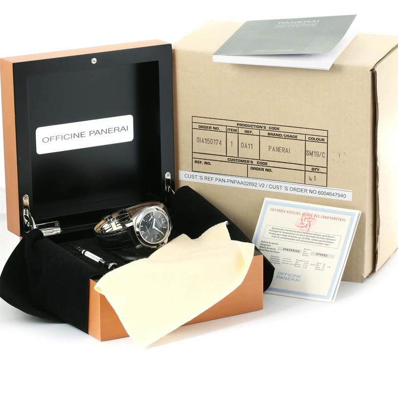 The image shows a Panerai Luminor PAM00048 Men's Stainless Steel Black Dial PAM00048 Men's Stainless Steel Black Dial watch and its accessories, including its box, paperwork, a cleaning cloth, and tools.