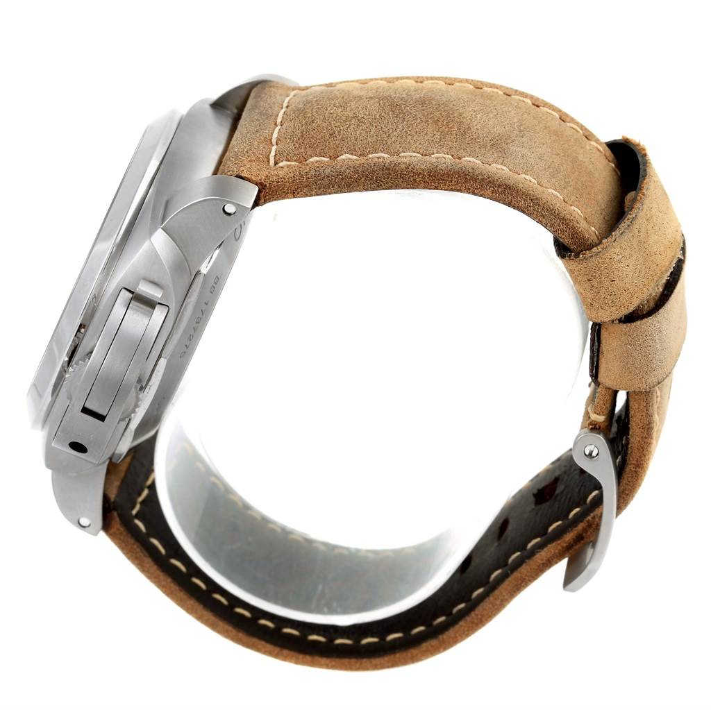 This side-angle view of the Panerai Luminor PAM00351 Men's Titanium Black Dial PAM00351 Men's Titanium Black Dial watch shows its case, crown protector, and leather strap.