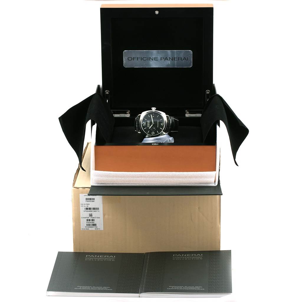 The image shows a Panerai Radiomir PAM00388 Men
s Stainless Steel Black Dial PAM00388 Men
s Stainless Steel Black Dial watch in its open display box with booklets in front of the box, photographed from the front.