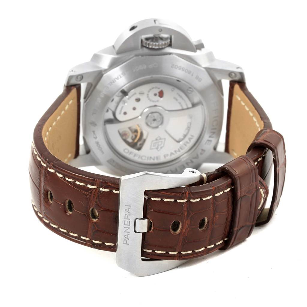 The image shows the back view of a Panerai Luminor PAM00320 Men's Stainless Steel Black Dial PAM00320 Men's Stainless Steel Black Dial watch, highlighting its transparent case back and brown leather strap.