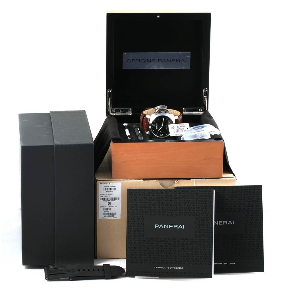 The image shows the Panerai Luminor PAM00320 Men's Stainless Steel Black Dial PAM00320 Men's Stainless Steel Black Dial watch in its box, along with watch accessories, manuals, an extra strap, and packaging.
