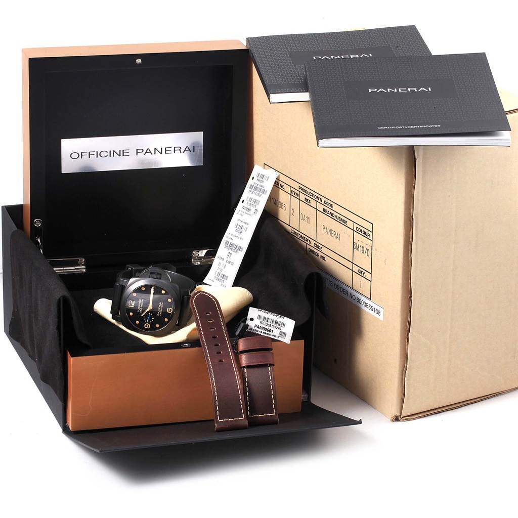 The image shows a Panerai Luminor PAM00661 Men's Titanium Black Dial PAM00661 Men's Titanium Black Dial watch with its case, extra strap, tags, booklets, and packaging box from a front angle.