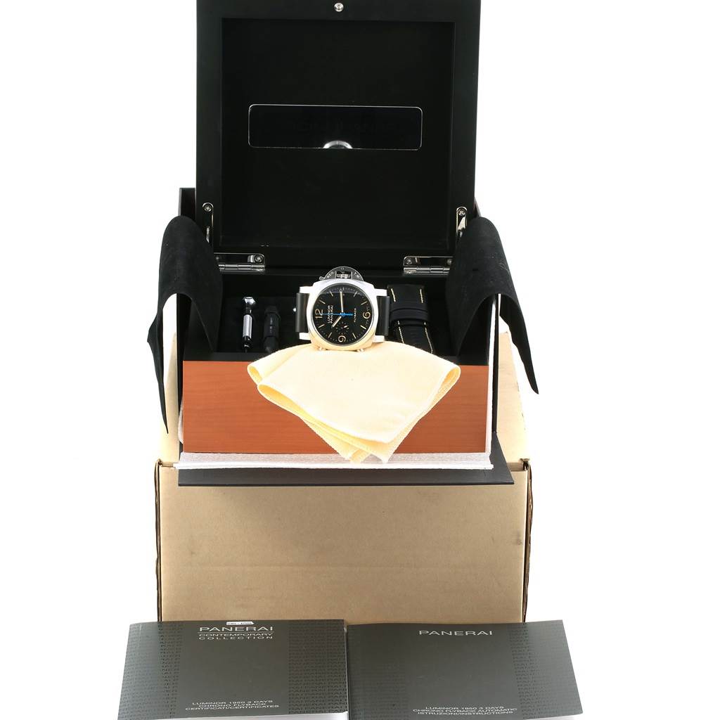 This image shows a Panerai Luminor PAM00524 Men's Stainless Steel Black Dial PAM00524 Men's Stainless Steel Black Dial watch in its box, accompanied by accessories such as a cleaning cloth, tools, and documentation.