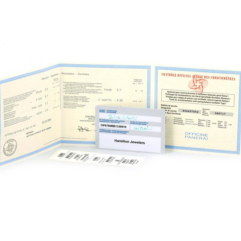 Documents and certificates for a Panerai Luminor PAM00104 Men's Stainless Steel Black Dial PAM00104 Men's Stainless Steel Black Dial watch, including warranty cards and labels, are shown laid out flat.