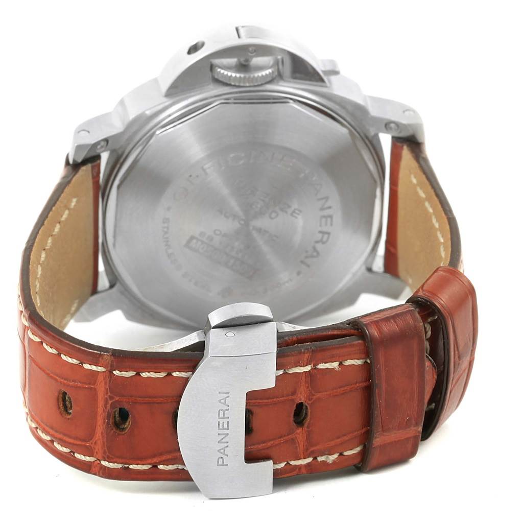 The image shows the back view of a Panerai Luminor PAM00104 Men's Stainless Steel Black Dial PAM00104 Men's Stainless Steel Black Dial watch, highlighting the case back, crown guard, and brown leather strap with the buckle.