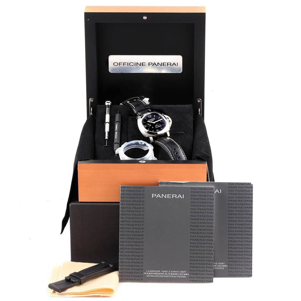The image shows a Panerai Luminor PAM00321 Men's Stainless Steel Black Dial PAM00321 Men's Stainless Steel Black Dial watch with accessories, including straps and tools, placed in an open box from an elevated front angle.