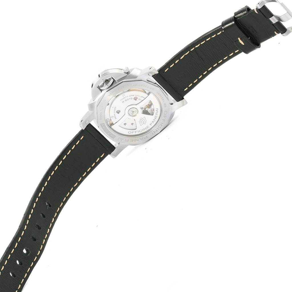 The image shows the backside of a Panerai Luminor PAM01392 Men
s Stainless Steel Black Dial PAM01392 Men
s Stainless Steel Black Dial watch, highlighting the case back and the movement inside, with its strap fully laid out.