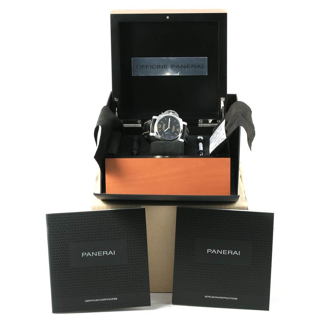 The image shows a Panerai Luminor PAM01392 Men
s Stainless Steel Black Dial PAM01392 Men
s Stainless Steel Black Dial watch within an open box, alongside warranty and instruction booklets.