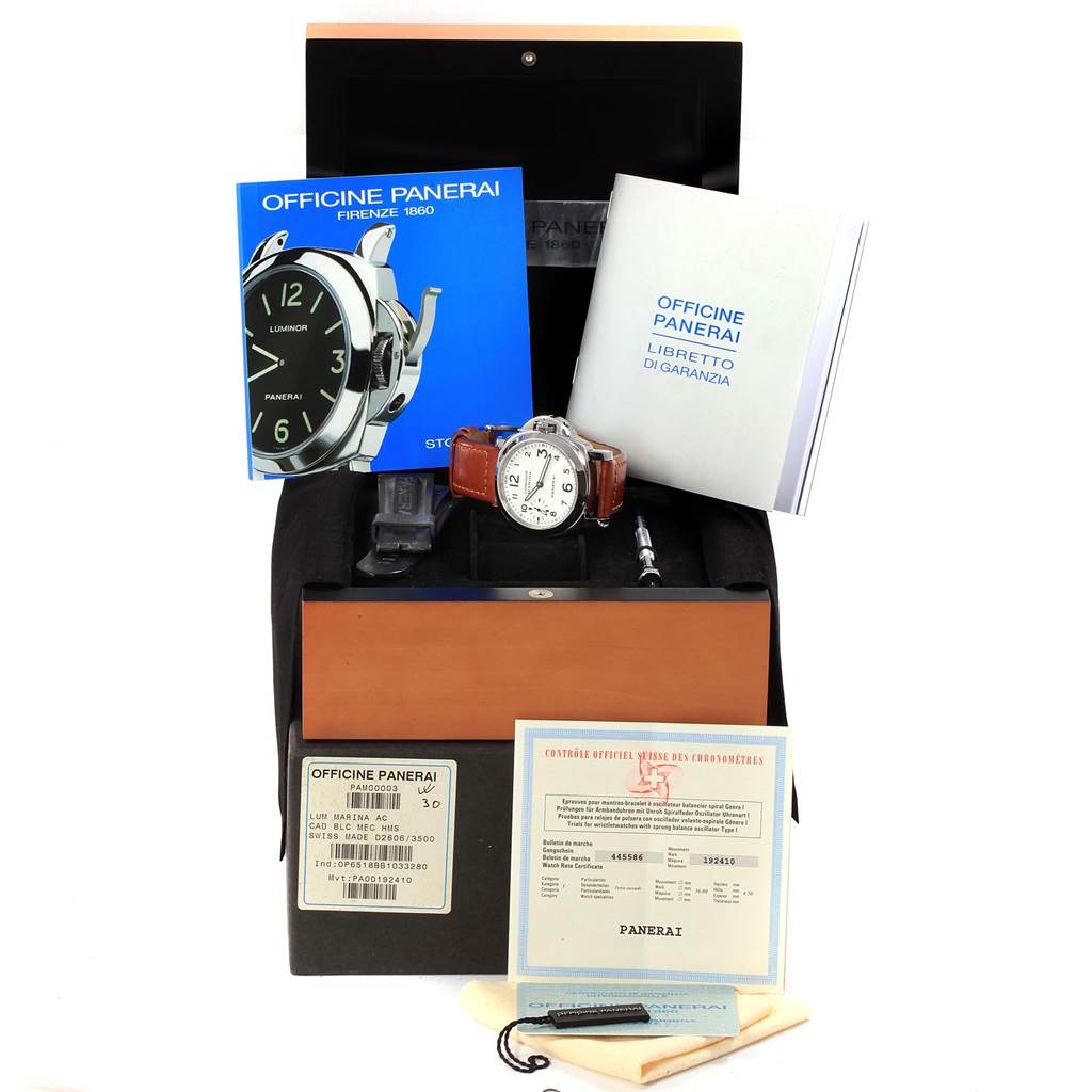 The image shows a Panerai Luminor PAM00003 Men's Stainless Steel White Dial PAM00003 Men's Stainless Steel White Dial watch with accessories and documentation, photographed from a front angle.