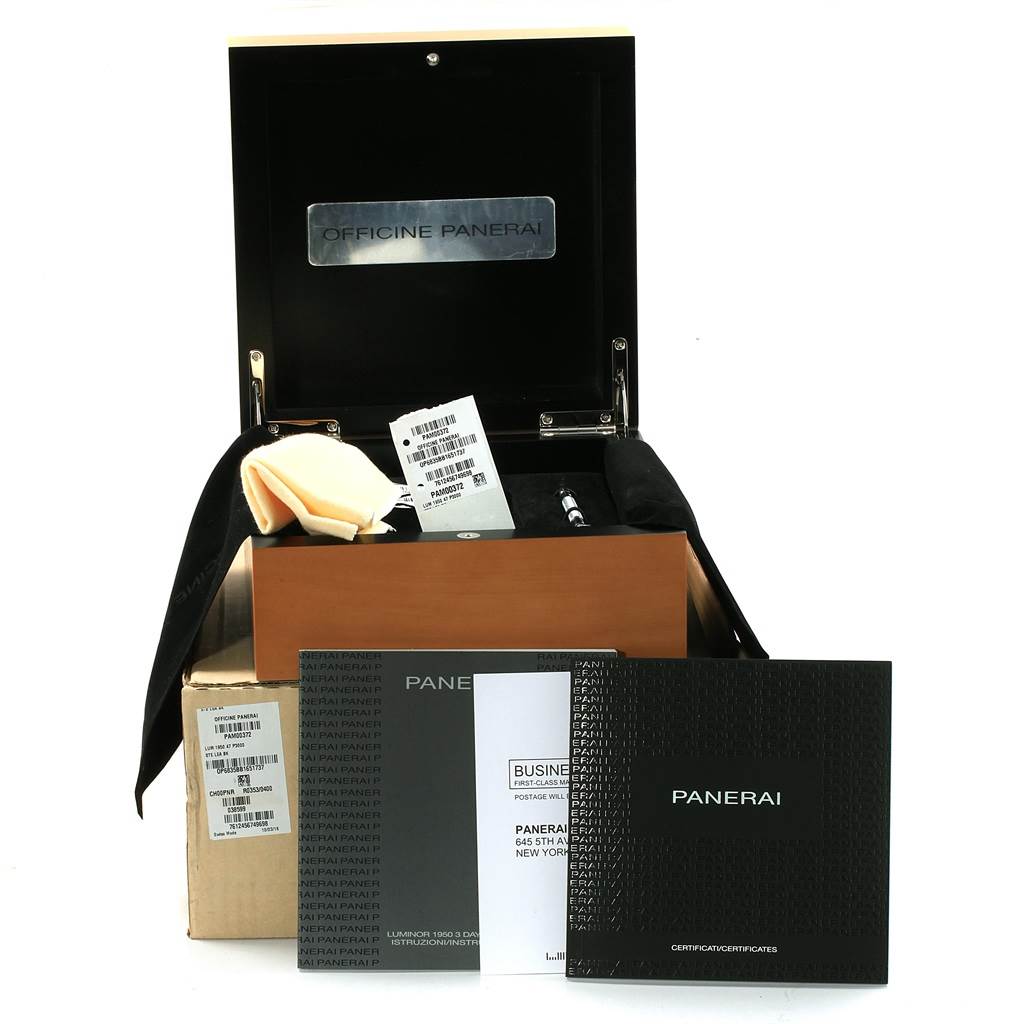 The image shows the accessories for a Panerai Luminor PAM00372 Men
s Stainless Steel Black Dial PAM00372 Men
s Stainless Steel Black Dial watch, including the presentation box, manuals, and a cleaning cloth.