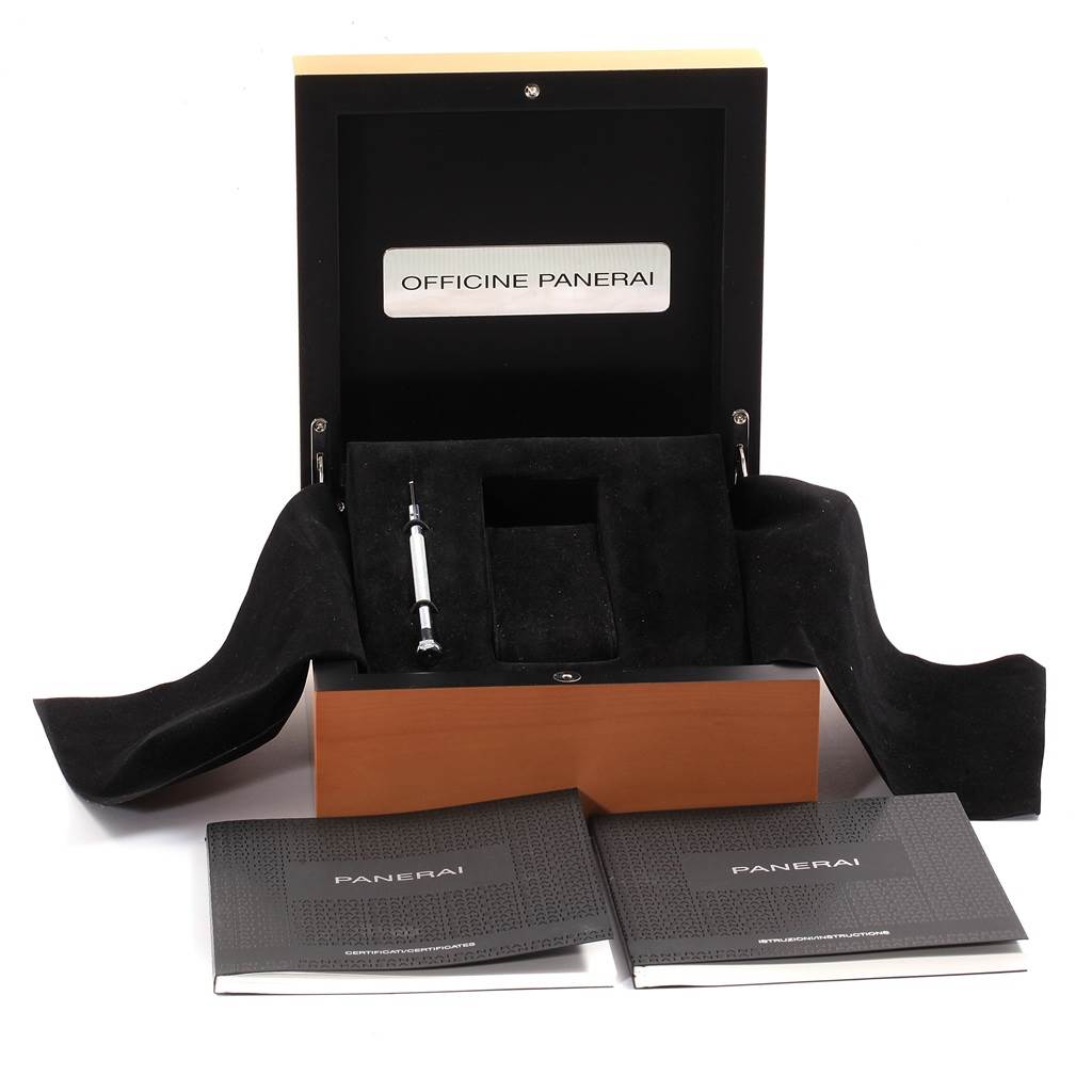 This image shows an open Panerai Luminor PAM00537 Men
s Stainless Steel Black Dial PAM00537 Men
s Stainless Steel Black Dial watch box with accompanying booklets and a tool.