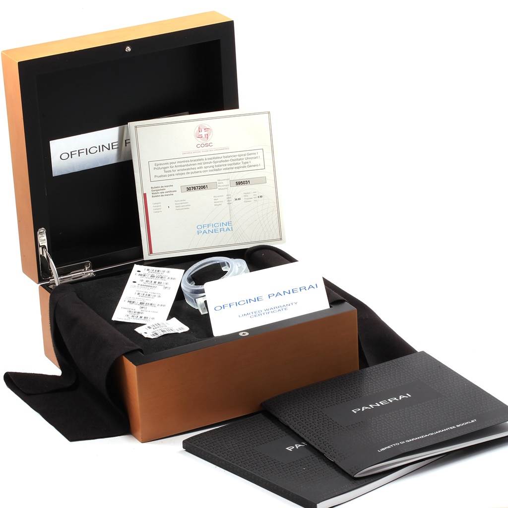 The image shows an open box containing the Luminor model by Panerai, along with its documents and accessories.