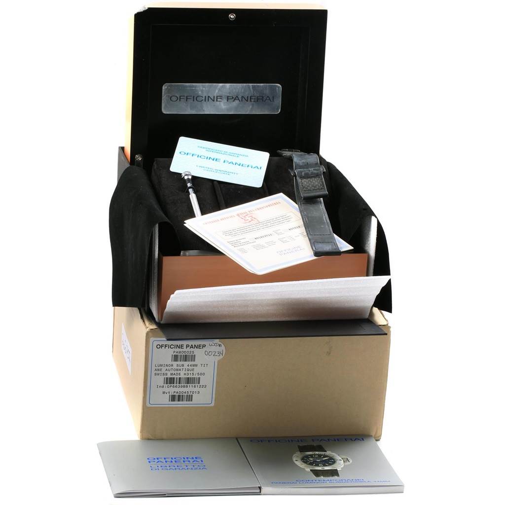 The Panerai Submersible PAM00025 Men's Titanium Black Dial PAM00025 Men's Titanium Black Dial watch set is shown in an open box with accessories, documentation, and spare strap visible.