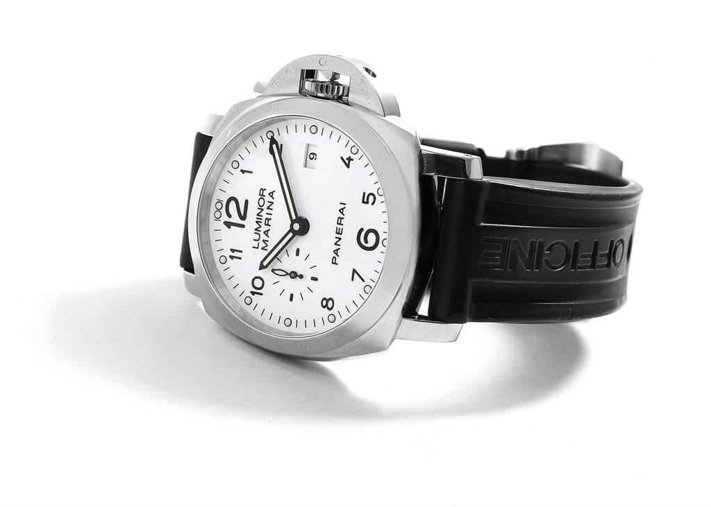 The Luminor Panerai watch is shown at a slight angle, highlighting its face, bezel, crown guard, and black rubber strap.