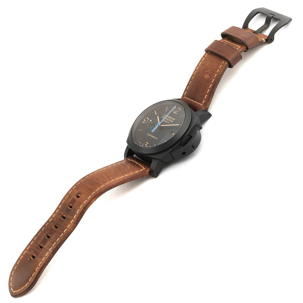 The image shows a Panerai Luminor PAM00580 Men's Stainless Steel Black Dial PAM00580 Men's Stainless Steel Black Dial watch at a slight angle, featuring its brown leather strap and black dial.