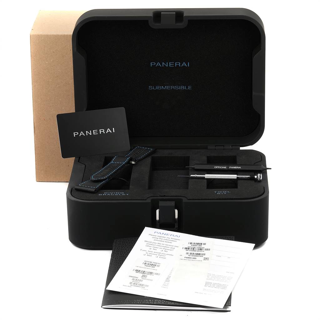 The image shows the open case of a Panerai Submersible PAM01389 Men's Titanium Black Dial PAM01389 Men's Titanium Black Dial watch, including straps, tools, documents, and a display card.