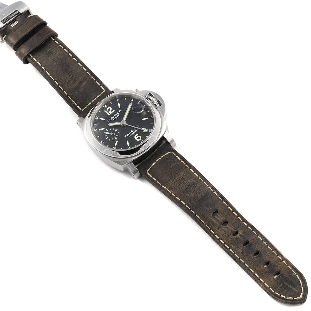 The image shows a top-down view of a Panerai Luminor PAM00244 Men
s Stainless Steel Black Dial PAM00244 Men
s Stainless Steel Black Dial watch with a black dial and a brown leather strap.