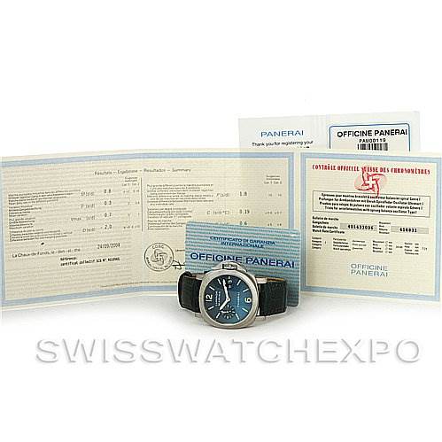 The image shows a Panerai Luminor PAM 119 OR PAM119 OR Men's Stainless Steel Blue Dial PAM 119 OR PAM119 OR Men's Stainless Steel Blue Dial watch, face-up, alongside its paperwork and certificates arranged behind it.