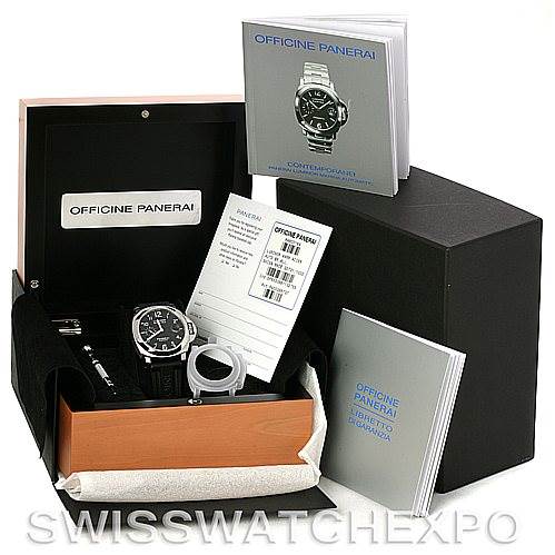 The image shows a Panerai Luminor PAM164 Men
s Stainless Steel Black Dial PAM164 Men
s Stainless Steel Black Dial watch and its accessories, including manuals, a box, and a warranty card, from a side angle.