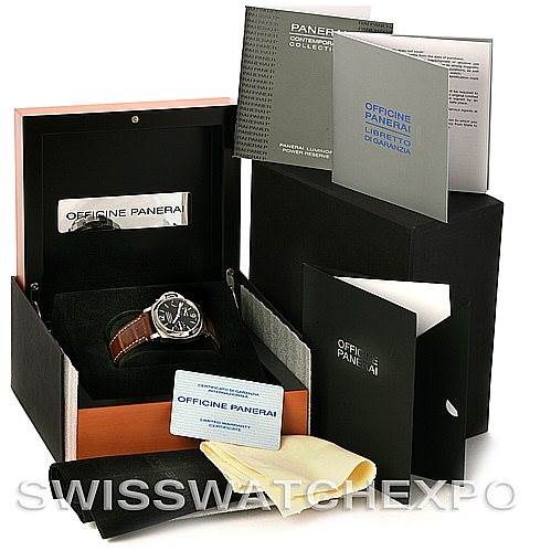 The image shows a Panerai Luminor PAM241 Men
s Stainless Steel Black Dial PAM241 Men
s Stainless Steel Black Dial watch in its open box, alongside its accessories and documentation.