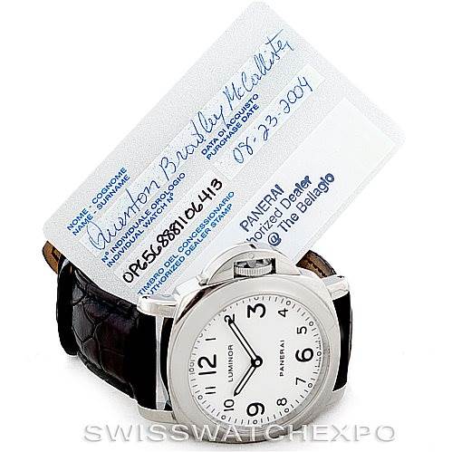 The image shows a Panerai Luminor PAM114 Men
s Stainless Steel White Dial PAM114 Men
s Stainless Steel White Dial watch with a white dial and black strap, displayed alongside its warranty card.