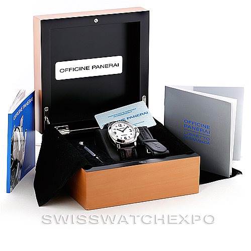 The image shows a Panerai Luminor PAM114 Men
s Stainless Steel White Dial PAM114 Men
s Stainless Steel White Dial watch in an open wooden box, accompanied by booklets and a strap-changing tool.